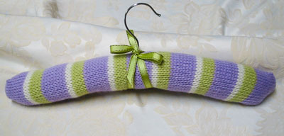 Image of our finished Striped Coat Hanger Cover knitting pattern